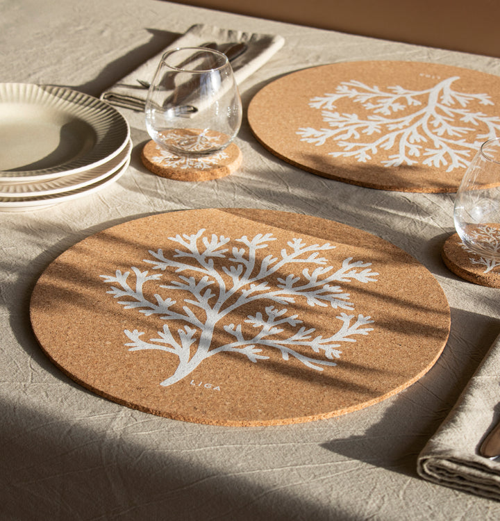 Eco natural cork coral placemat laid out on a table