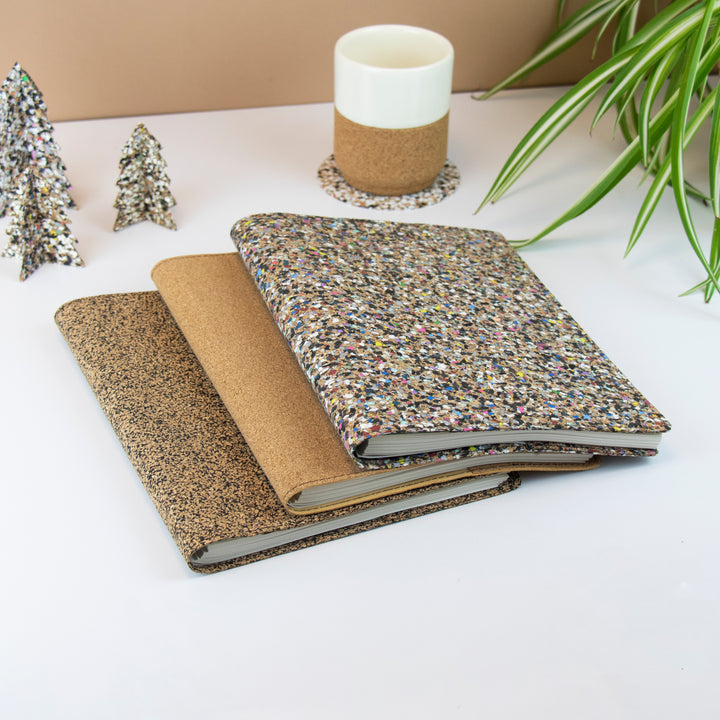Refill notebooks made out of re-cycled waste materials including natural cork, recycled rubber and recycled EVA plastics