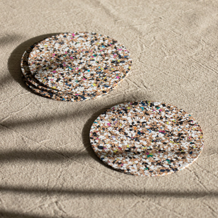 Beach clean coasters on a table made out of EVA plastics and natural cork