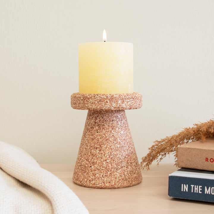 Candle holder made of recycled sweetcorn husks, which holds thick candle