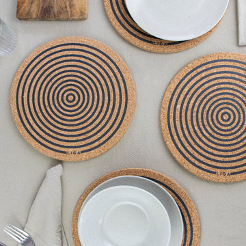 Orbit design cork placemats on table