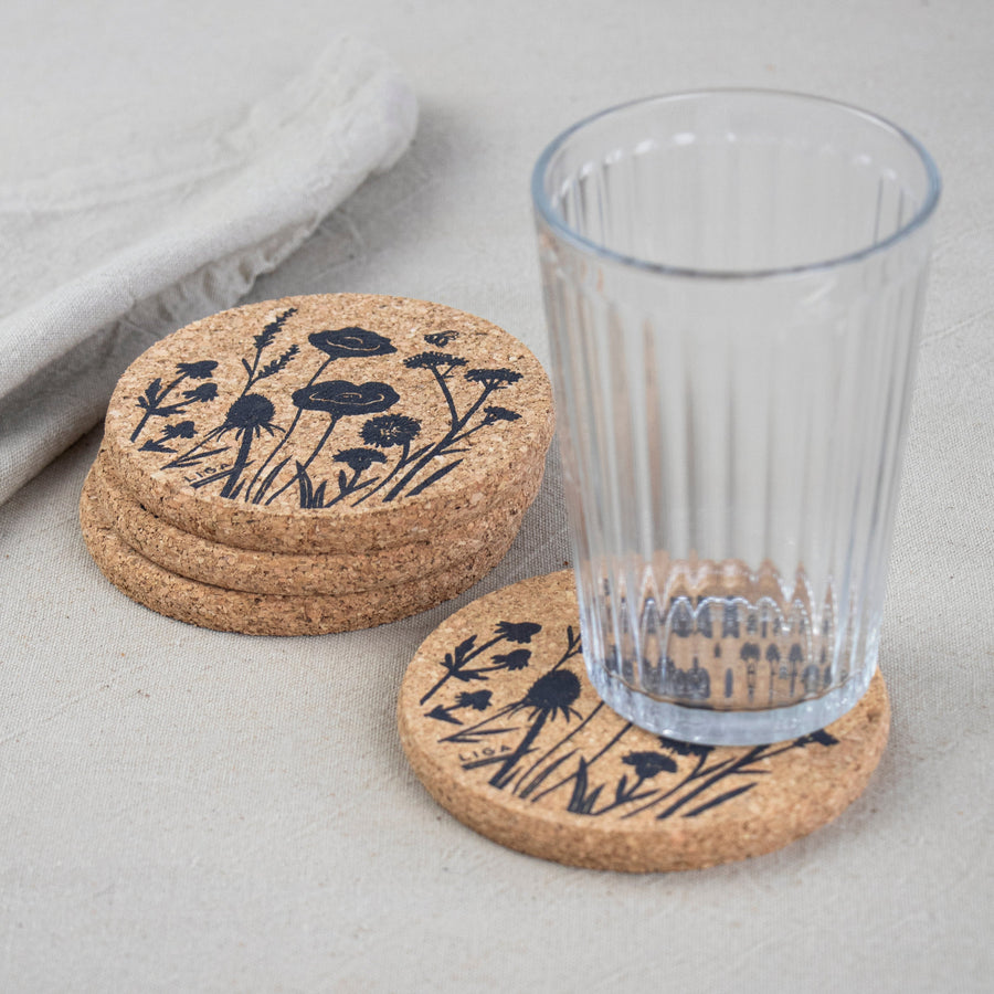 Cork coaster set of 4 with Wildflower design on table with glass