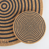 cork coaster with orbit design with placemat behind